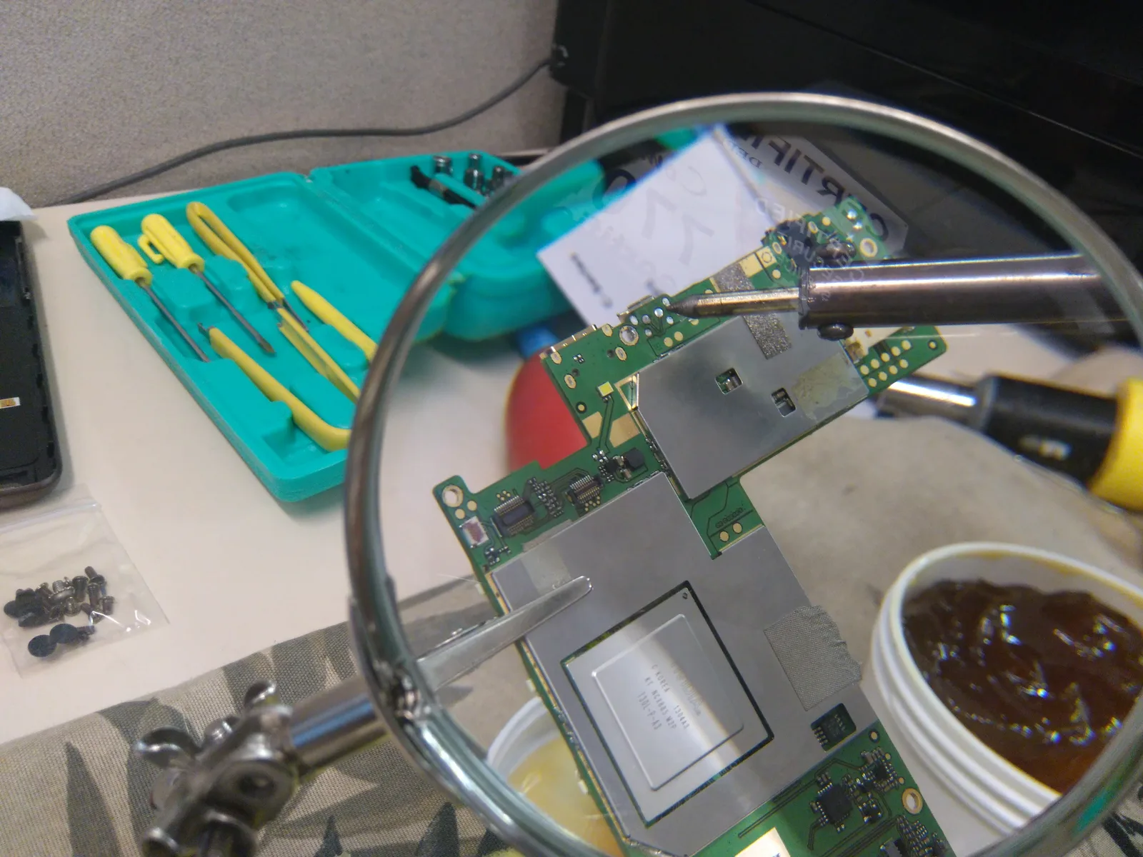 Micro-soldering circuit board repair under magnification at SUZU PC and Web in Atlanta, GA